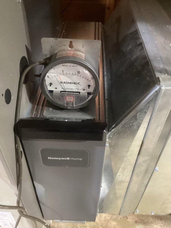 Successfully completed installation of a new Honeywell furnace system with digital thermostat upgrade. Installed and calibrated a Magnehelic gauge to monitor system pressure differentials for optimal performance. The new setup includes both the legacy Aprilaire controller and modern Honeywell Home digital thermostat, ensuring seamless climate control transition.