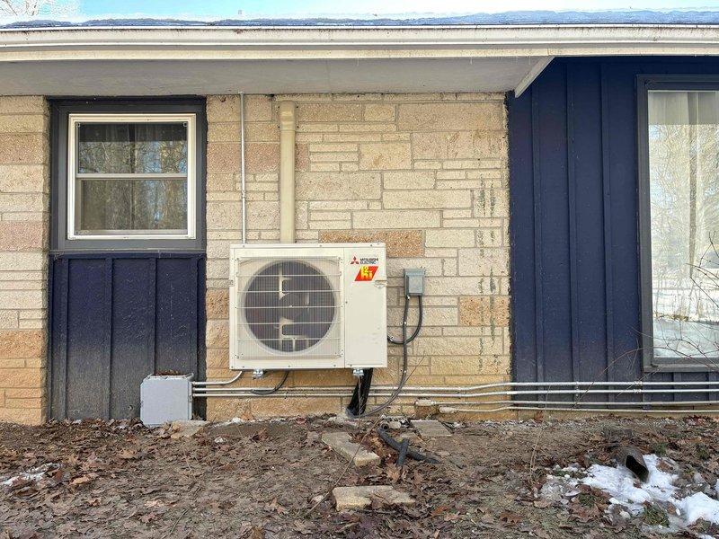Successfully installed a Mitsubishi mini-split system in client's residence, including interior wall-mounted air handler and exterior heat pump condenser secured to stone veneer wall. Completed all electrical connections and refrigerant line installations between indoor and outdoor units, ensuring proper system operation and adherence to manufacturer specifications.