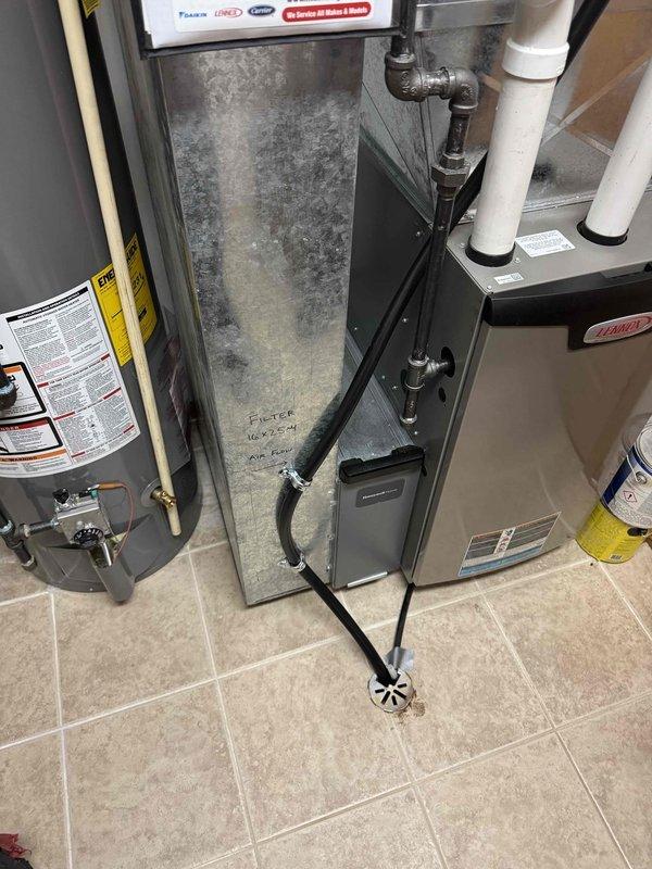 Installed a Honeywell Home HM750A1000 humidifier system to address indoor air quality concerns. Conducted comprehensive inspection of existing HVAC system, noting severely clogged air filter requiring immediate replacement. Connected humidifier to existing ductwork and plumbing with proper drainage to floor drain, ensuring optimal humidity control for the residence.