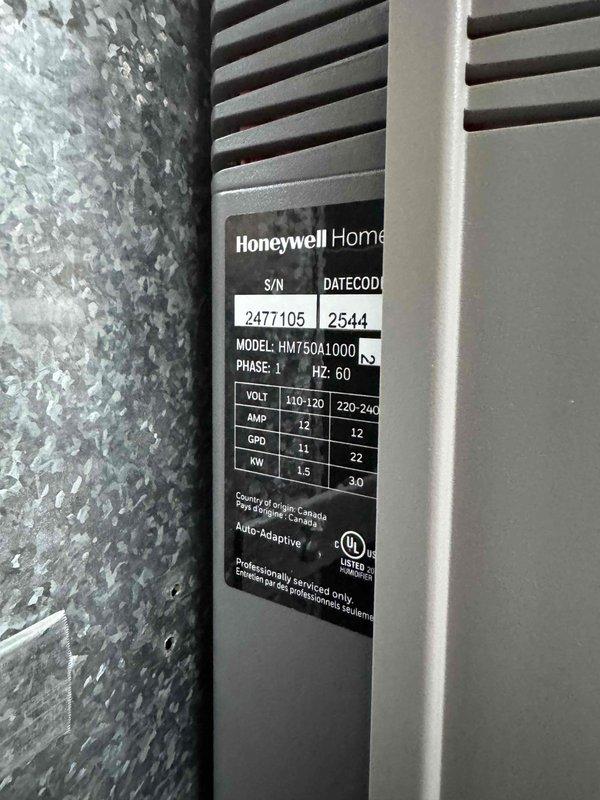 Installed a Honeywell Home HM750A1000 humidifier system to address indoor air quality concerns. Conducted comprehensive inspection of existing HVAC system, noting severely clogged air filter requiring immediate replacement. Connected humidifier to existing ductwork and plumbing with proper drainage to floor drain, ensuring optimal humidity control for the residence.
