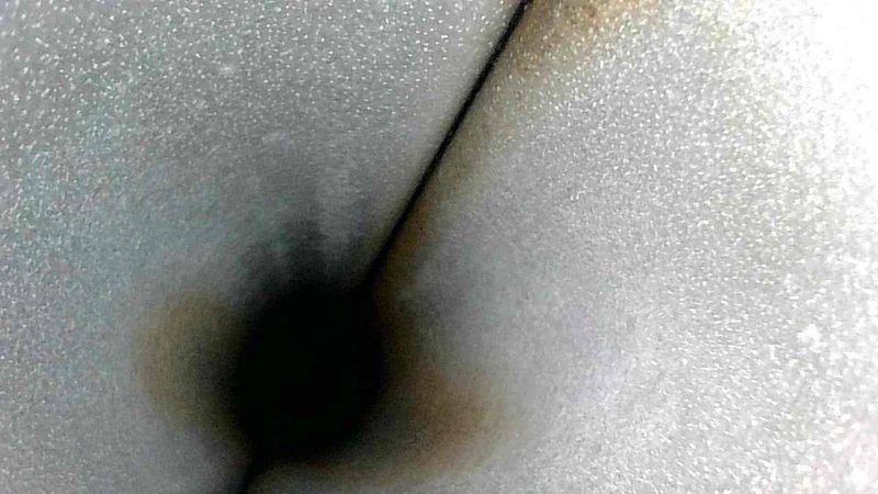 Performed leak detection test on HVAC system using pressure diagnostics, identifying a 1.52 inH₂O reading during a timed test. Discovered and documented compromised ductwork insulation with visible cavity/opening that could affect system efficiency and indoor air quality.