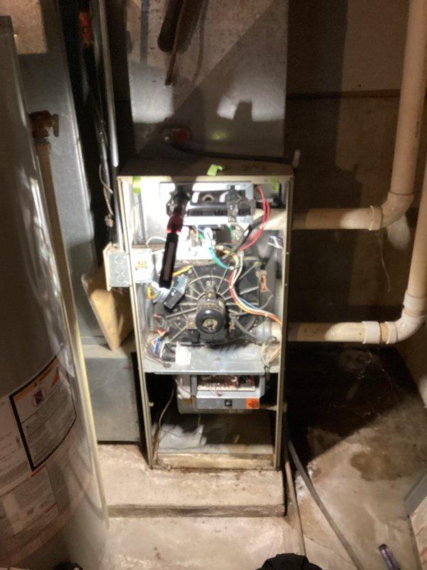 Completed comprehensive annual tune-up on customer's furnace. Removed front panels to access and inspect internal components, including blower motor, control board, and electrical connections. Cleaned dust accumulation from key components and verified proper operation of the system. All connections are secure and system is functioning within normal parameters.