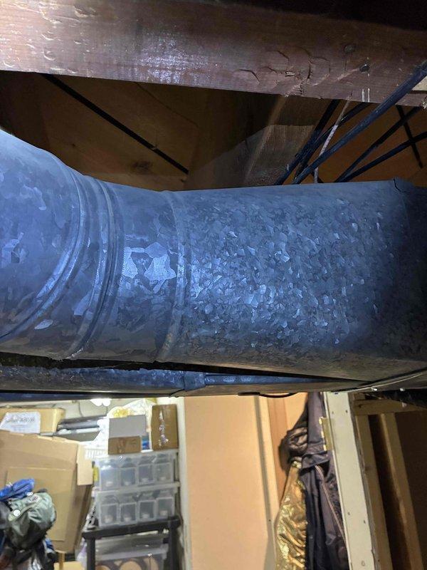 Performed routine inspection of HVAC system, examining the galvanized sheet metal ductwork in the utility space for proper installation and integrity. Verified operation of Honeywell Home ProSeries thermostat, confirming heating mode functionality with system set to 67°F and fan in auto mode.