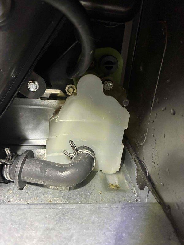 Conducted inspection and assessment of client's Bryant HVAC furnace system located in basement utility area. Identified and documented condensate collection system with visible moisture accumulation around the reservoir. Unit appears to be properly installed with standard ductwork connections and gas line configurations.