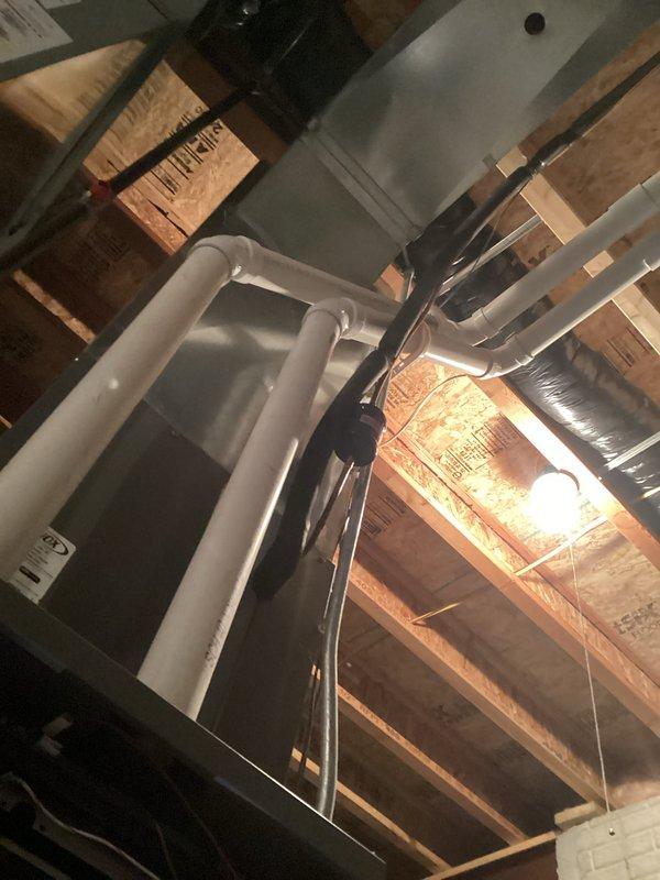 Conducted comprehensive HVAC system tune-up in unfinished basement area. Verified proper leveling and alignment of air handler unit, ensuring optimal operational stability. Inspected all ductwork connections, PVC drain lines, and trunk line distribution system for proper installation and functionality.