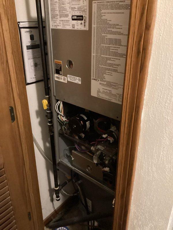 Performed scheduled maintenance on residential HVAC system. Conducted thorough inspection of furnace with access panel open, checking all internal components including motor, wiring, and mechanical parts. Visual inspection of connected PVC venting system completed with no issues noted.