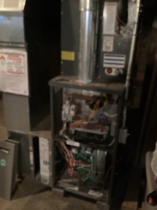 Performed scheduled HVAC maintenance service on furnace system, conducting thorough inspection of internal components including circuit boards, wiring harnesses, and control modules. Noted significant water damage around water heater with visible mineral deposit rings indicating possible ongoing leak; documented condition with photos for customer reference and recommended further assessment of water heater to prevent potential damage to HVAC equipment.