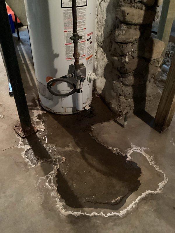 Performed scheduled HVAC maintenance service on furnace system, conducting thorough inspection of internal components including circuit boards, wiring harnesses, and control modules. Noted significant water damage around water heater with visible mineral deposit rings indicating possible ongoing leak; documented condition with photos for customer reference and recommended further assessment of water heater to prevent potential damage to HVAC equipment.