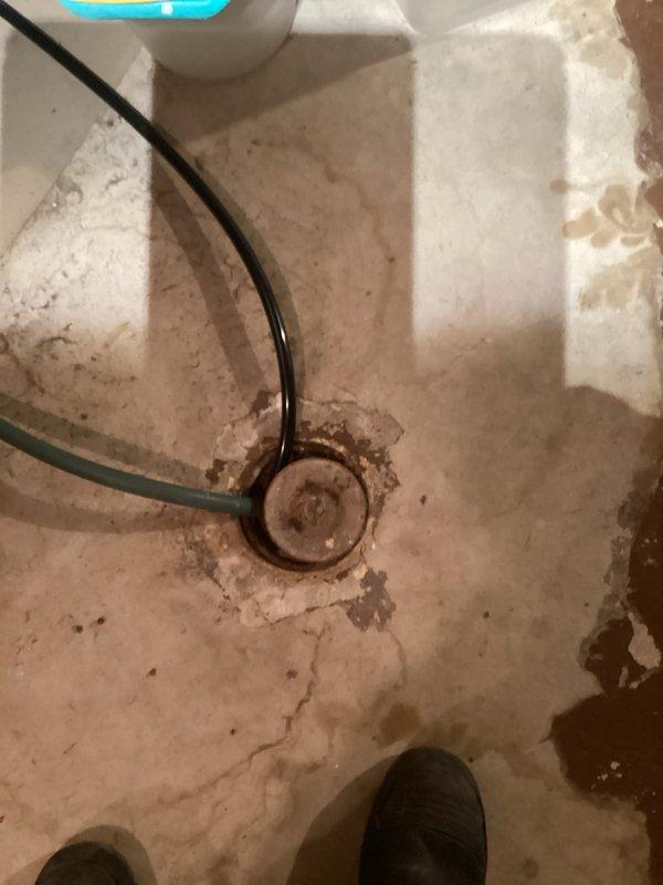 Completed installation of a new furnace system, including necessary drainage connections as evidenced by the concrete floor drain assessment. Verified proper exterior PVC venting configuration through the home's siding, ensuring code-compliant exhaust pathways for safe system operation.