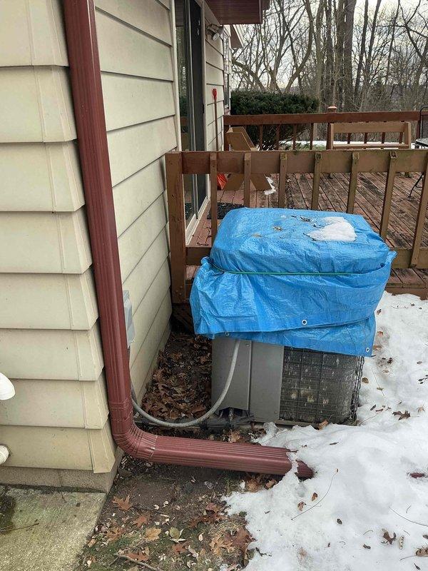 Conducted estimate for complete HVAC system replacement. Existing outdoor unit was observed covered with protective tarp on concrete pad with visible connection lines. Inspected electrical panel to evaluate service capacity for potential new equipment installation.