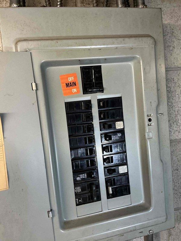 Conducted estimate for complete HVAC system replacement. Existing outdoor unit was observed covered with protective tarp on concrete pad with visible connection lines. Inspected electrical panel to evaluate service capacity for potential new equipment installation.