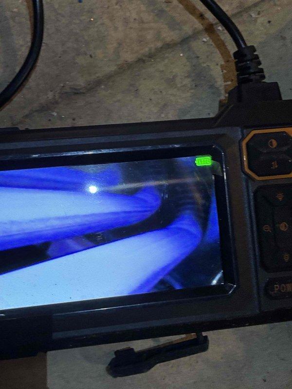 Performed diagnostic assessment on HVAC system utilizing electronic testing equipment to analyze operational parameters. Conducted internal component inspection with specialized tools, examining motor assembly and wiring connections (black, orange, and yellow) for proper functionality. All readings within acceptable ranges and system restored to optimal working condition.