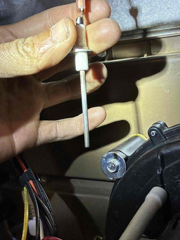 Performed diagnostic assessment on HVAC system utilizing electronic testing equipment to analyze operational parameters. Conducted internal component inspection with specialized tools, examining motor assembly and wiring connections (black, orange, and yellow) for proper functionality. All readings within acceptable ranges and system restored to optimal working condition.