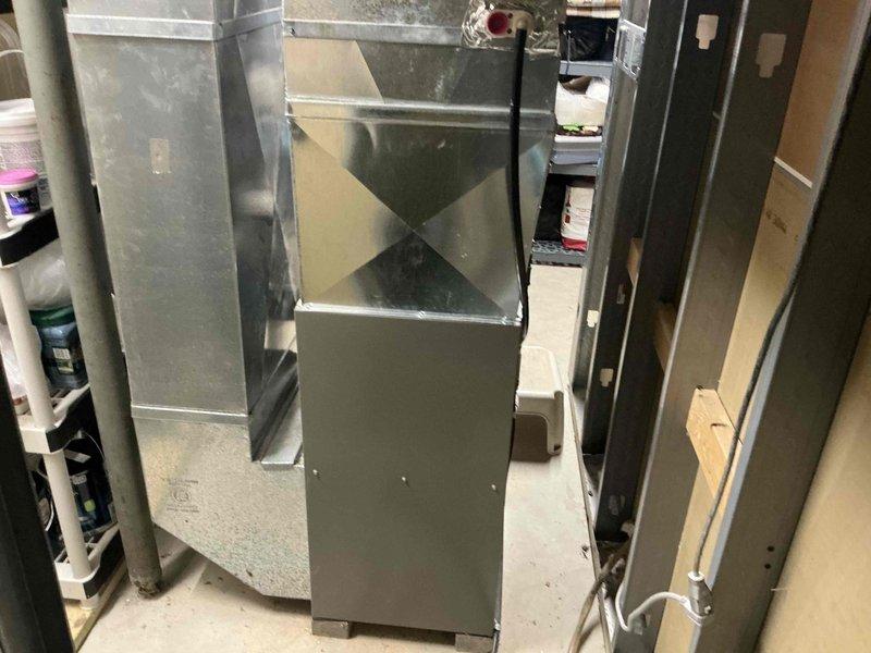 Performed assessment of existing HVAC system and proposed replacement of outdated Lennox furnace unit. Current installation includes standard sheet metal ductwork with diamond-shaped transition piece and PVC ventilation pipes. Recommended new high-efficiency system with proper connections to existing utility infrastructure in basement mechanical area.