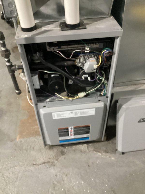 Performed comprehensive tune-up service on an AIRE-FLO furnace system in basement. Opened unit to inspect internal components including control board, wiring harnesses, and motor assembly. Verified proper function of ventilation system with particular attention to the PVC exhaust pipes and gas line connections.