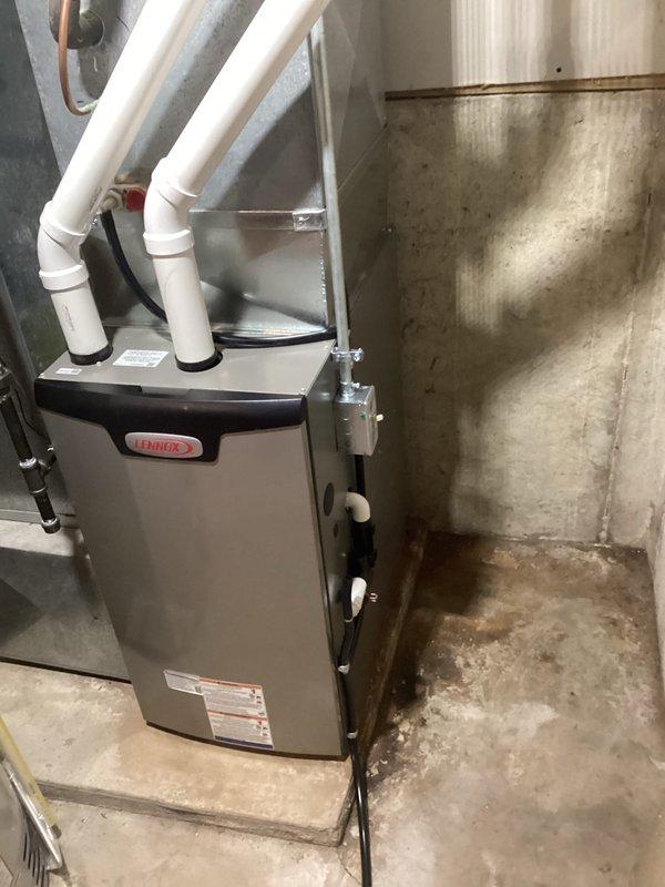 Successfully installed a new Lennox furnace in the utility room, replacing the previous unit. Completed installation of PVC exhaust venting system with appropriate elbow joints for proper ventilation. System was tested and confirmed to be functioning according to manufacturer specifications.