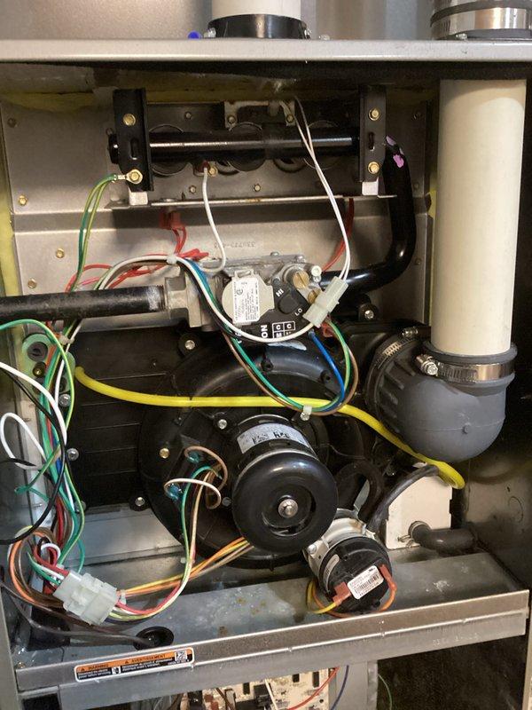 Performed routine maintenance tune-up on Goodman furnace system. Conducted thorough inspection of internal components including motor assembly, wiring connections, and control board - all components found in normal working condition. Examined installation integrity of PVC venting system and checked ductwork throughout utility area, confirming proper airflow and ventilation.