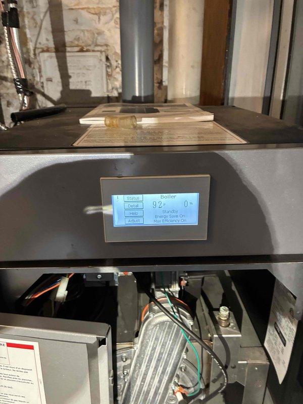 Performed comprehensive tune-up service on SuperStor stainless steel indirect water heater system with green expansion tank. Inspected and verified proper operation of the boiler control system showing normal parameters (Target: 92°, Energy Save On, Mod Efficiency On). Checked circulation pump functionality, confirmed proper insulation of piping network, and validated all mechanical components were operating within specifications. System left in optimal working condition with all safety features functioning correctly.