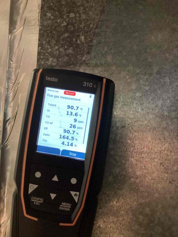 Performed comprehensive furnace tune-up including combustion analysis using Testo 310. Measurements revealed optimal system efficiency at 90.7% with acceptable CO levels (9 ppm raw/26 ppm air-free) and proper CO2 concentration at 4.14%. Conducted full inspection of internal components, verified electrical connections and control board functionality, and confirmed blower assembly operation.