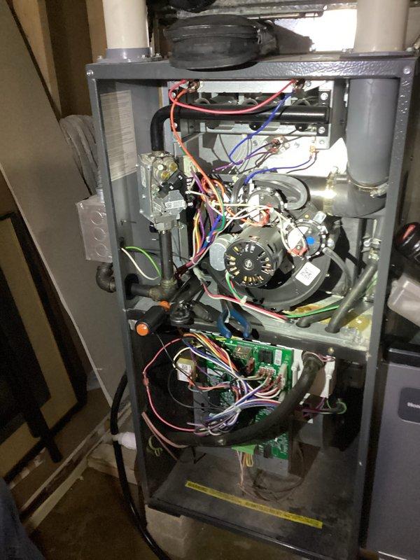 Performed comprehensive furnace tune-up including combustion analysis using Testo 310. Measurements revealed optimal system efficiency at 90.7% with acceptable CO levels (9 ppm raw/26 ppm air-free) and proper CO2 concentration at 4.14%. Conducted full inspection of internal components, verified electrical connections and control board functionality, and confirmed blower assembly operation.