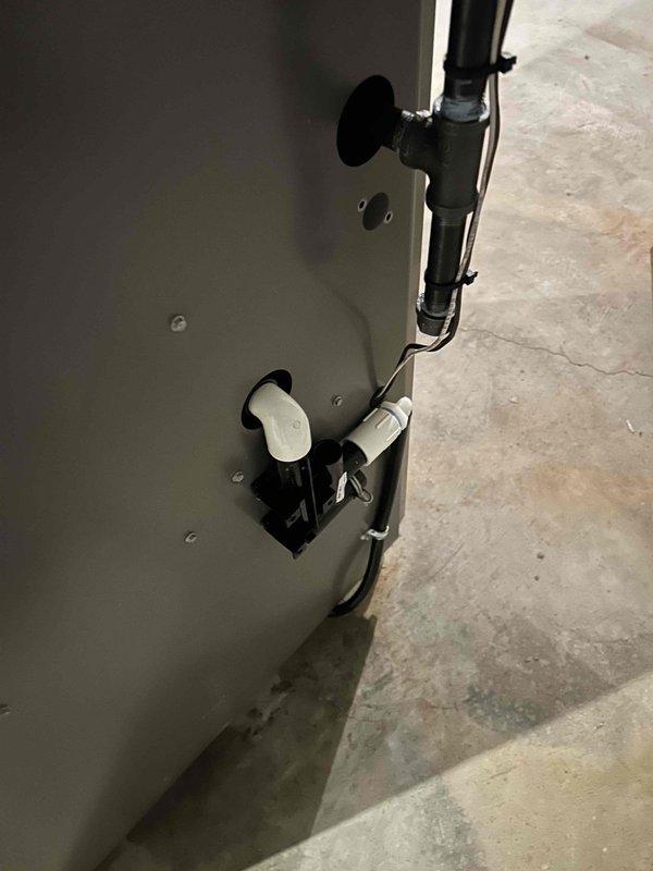 Successfully installed new furnace unit in basement location. Completed proper drainage system installation with PVC condensate lines and secured all connections. Ensured unit was properly positioned on concrete floor with appropriate clearance for ventilation and maintenance access.