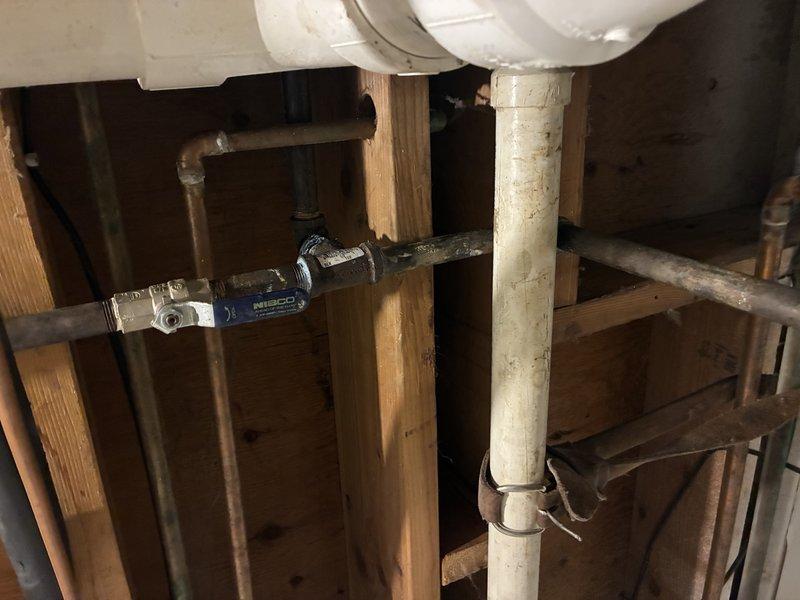 Completed plumbing repair in crawlspace/basement area involving inspection and potential replacement of PVC and copper pipe components. Service included maintenance of connections at valve junction points where the supply system interfaces with drainage components within the structural framework.