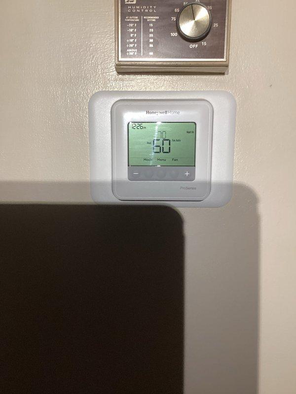 Installed and configured a new Honeywell Home ProSeries digital thermostat system with Heat-On functionality, maintaining the existing analog humidity control device. Properly routed and installed PVC condensate drain pipes from the furnace to the exterior of the home, ensuring proper drainage away from the foundation.