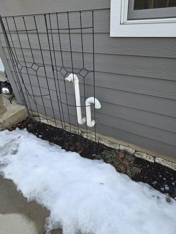 Completed installation of a new furnace system with proper venting configuration. Installed and connected PVC exhaust pipes in an "h" pattern on exterior wall per manufacturer specifications. Conducted electronic system testing with Klein Tools meter showing operational efficiency factor (EF) of 15, confirming proper startup and functionality of the new unit.