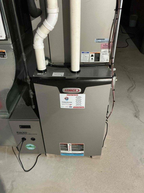 Performed preventive maintenance tune-up on customer's Lennox HVAC system. Temperature testing revealed unit operating at 103.6°F, which is within acceptable parameters. Inspected all components including the Pure Air filtration system, verified proper venting through PVC exhaust, and confirmed system operation. All equipment found in good working condition with no signs of leaks or damage.