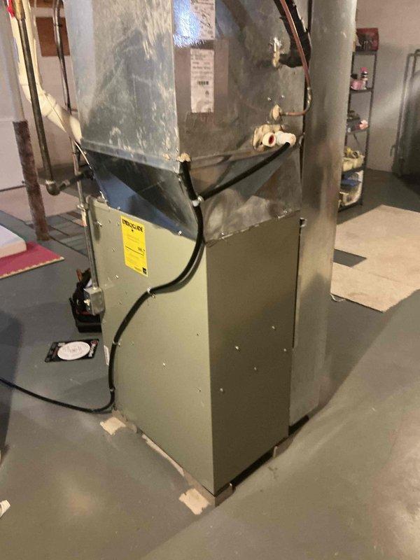Completed site assessment and measurements for HVAC system replacement. Documentation includes detailed floor plan with dimensions (10'x25'x36'x24'x17'6" with 53" height clearance) calculating approximately 1,300 square feet total area. Existing furnace system was inspected, noting connections to ductwork and insulation condition for proper specification of replacement unit.