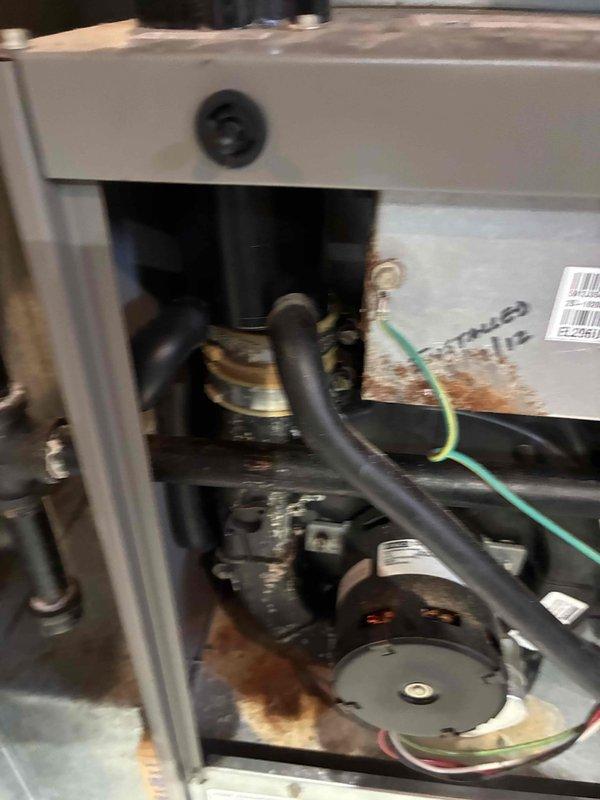 Conducted combustion analysis of natural gas furnace using Testo 310 II analyzer, yielding optimal readings with 95.0% efficiency, 11.0% O₂, and CO levels at 12 ppm. Inspected interior components of unit, noting minor corrosion on metal surfaces, and verified proper operation of motor assembly and electrical connections.