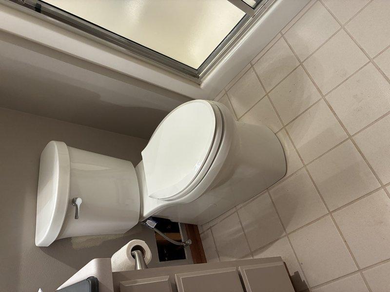 Accessed wall opening to inspect copper supply plumbing and shutoff valve. Performed necessary repairs to address leaking valve issue, then verified proper water flow and pressure to bathroom toilet. All connections were tested for leaks, and system is now functioning correctly.