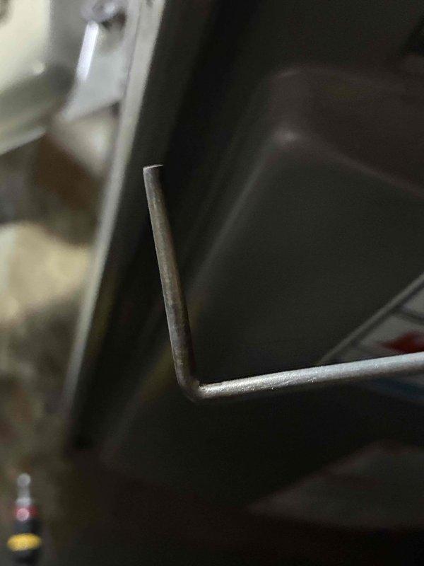 Performed standard HVAC tune-up service and identified oil leak from compressor fitting. Tightened fasteners on unit mounting bracket to prevent vibration damage. System now operating within normal parameters but will require follow-up maintenance to address the developing oil leak.