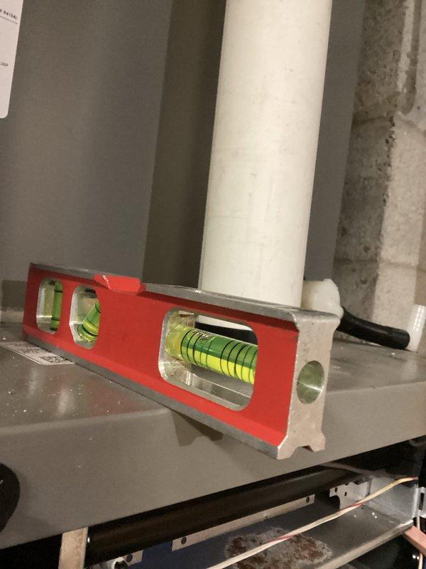 Performed routine seasonal tune-up on HVAC system. Inspected and verified proper leveling of condensate drain lines and equipment using precision level. No issues were found with the PVC drainage assembly or copper refrigerant piping connections during the visual assessment.