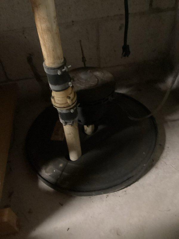 Responded to No Heat call for aging furnace (10+ years). Diagnosed ignition issues and confirmed proper flame pattern at burner assembly after service. Also inspected basement sump pump system, verifying proper discharge line connections and functionality to prevent water damage. System now operating within specifications.