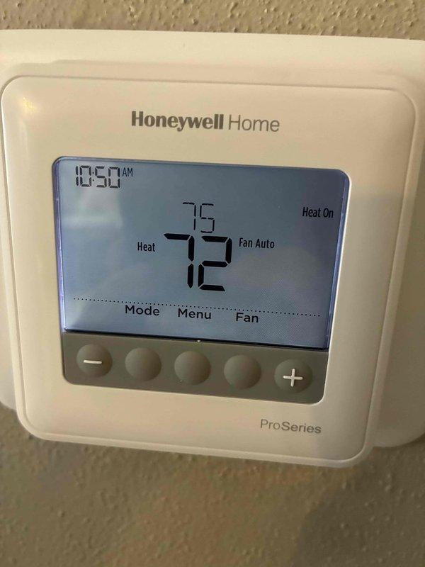 Completed service inspection on residential heating system. Tested thermostat functionality and confirmed proper operation in heating mode with the Honeywell Home ProSeries thermostat showing accurate temperature readings and appropriate heating response. System now operating at optimal settings with energy-saving mode enabled.