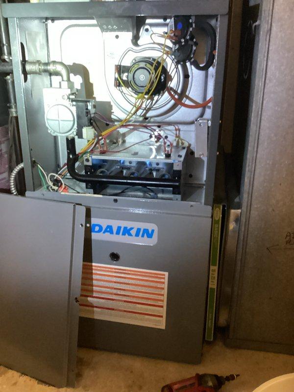 Responded to no-heat call for Daikin system under 10 years old. Upon inspection, discovered faulty ignition control board with visible burnt wiring connections. Replaced control board, checked all electrical connections, and verified proper system operation through complete heating cycle test. Unit now functioning properly with normal flame sequence and consistent heat output.