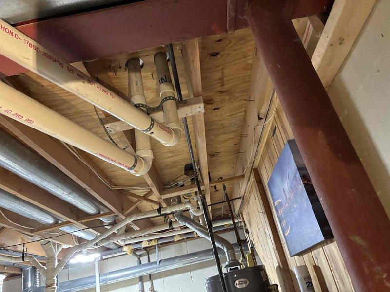 Performed inspection of furnace system located in basement utility area. Accessed interior components of the blower assembly to examine motor, electrical connections, and ventilation system. Visual inspection revealed normal operational condition of the furnace with no apparent mechanical or electrical issues identified.