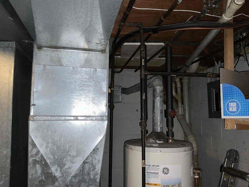 Completed replacement of aging HVAC system with new equipment including outdoor condensing unit and indoor air handler installation. System was properly connected to existing ductwork in the utility area, with all necessary electrical connections made according to manufacturer specifications. New filter system was installed to ensure optimal air quality and system performance.