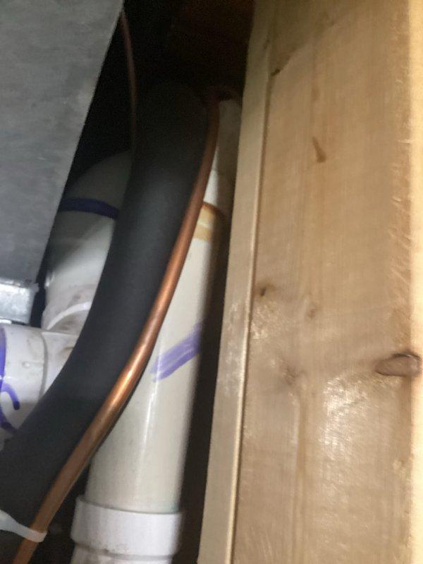 Completed furnace installation with proper pressure testing, verifying a reading of 0.19 on the digital manometer with ambient temperature at 61.6°F. Installation included running copper line alongside insulated black pipe and connecting to existing PVC drainage system with all connections properly sealed and secured.