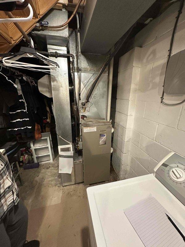 Conducted inspection of existing HVAC system in basement utility area, identifying aging furnace with outdated ductwork connections. Prepared comprehensive replacement estimate including new high-efficiency unit, reconfigured ductwork, and proper exterior ventilation solutions to replace current PVC exhaust configuration on exterior wall.