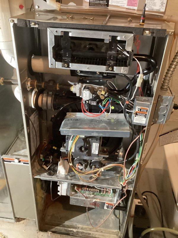 Performed comprehensive furnace tune-up service including inspection of internal components and combustion analysis. System showed normal operation with some dust accumulation on components. Combustion efficiency test using Testo 310 analyzer showed 86.8% efficiency with acceptable CO levels (4 ppm) and proper O2 readings (14.1%), confirming unit is operating within safe parameters.