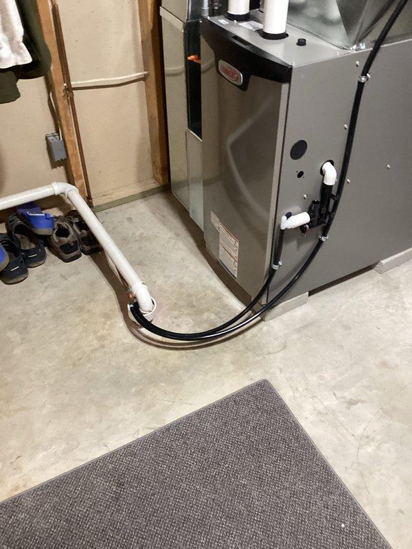 Successfully installed a new Lennox furnace system in the basement utility room. Completed all necessary ductwork connections and properly secured metal fasteners at all joints. Finalized installation with proper venting through white exhaust pipes and verified all electrical components were correctly wired and operational.