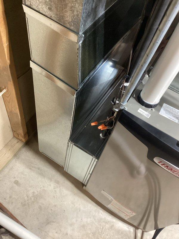 Successfully installed a new Lennox furnace system in the basement utility room. Completed all necessary ductwork connections and properly secured metal fasteners at all joints. Finalized installation with proper venting through white exhaust pipes and verified all electrical components were correctly wired and operational.