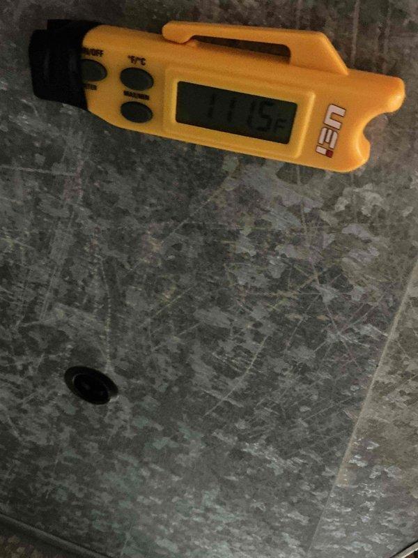 Performed scheduled HVAC tune-up, checking system temperature with digital thermometer (reading 77.9°F). Identified corrosion and rust formation around heat exchanger opening, indicating potential moisture intrusion or early-stage deterioration. Documented condition for monitoring during next maintenance visit.