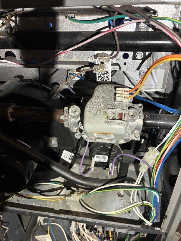 Diagnosed cooling system failure in a residential HVAC unit less than 10 years old. Inspection revealed control board malfunction in the air handler, identified by examining component specification labels and internal wiring connections. Replaced defective control board, reconnected all electrical terminals properly, and verified proper operation of cooling system before completing service.