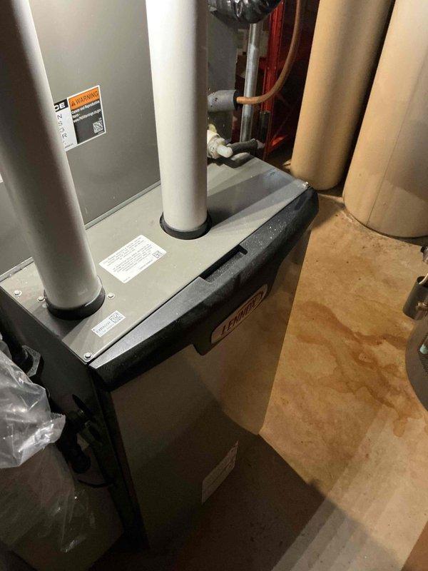 Performed standard tune-up on Lennox heating system including inspection of main unit, PVC intake/exhaust vents, and connecting ductwork. Conducted diagnostic measurements on the galvanized ductwork using digital instrumentation, confirming proper system function and installation integrity. System is operating within normal parameters with no issues detected.