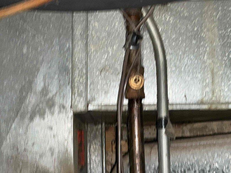 Conducted inspection of basement HVAC system components showing significant age and potential efficiency concerns. Evaluated existing copper piping connections and galvanized metal ductwork, noting visible wear and possible inadequate ventilation. Recommended complete replacement of the current system with properly sized equipment to improve energy efficiency and reliability.