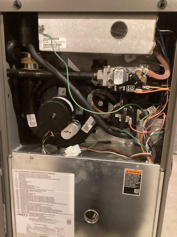 Performed comprehensive tune-up on the HVAC system, including inspection of internal components and wiring connections. Identified and cleaned water staining on floor beneath unit, likely from condensate drainage. All mechanical parts, fan assembly, and control boards were verified operational with no visible damage or irregularities.