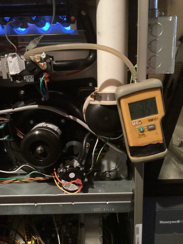 Performed seasonal tune-up on gas furnace with Honeywell accessory. Removed access panels for comprehensive inspection of internal components including blower motor assembly and control board. Conducted temperature testing using UEI EMT1 digital meter, confirming system operating temperature at 32°. All electrical connections, wiring, and venting (PVC) were inspected and verified to be in proper working condition.